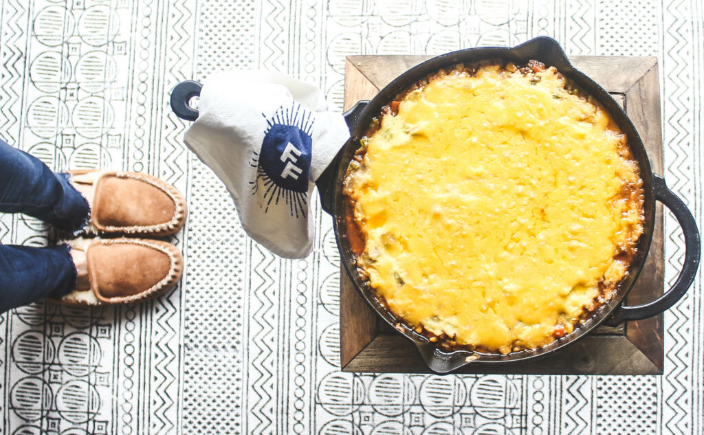 Baked cottage pie with cheesy mashed potato topping.