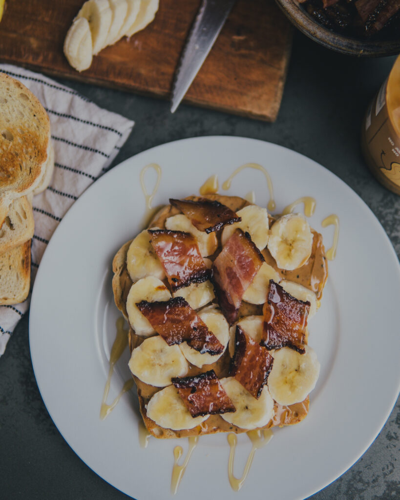 Overhead shot of PB Banana Toast w/ Hot Honey Bacon. 