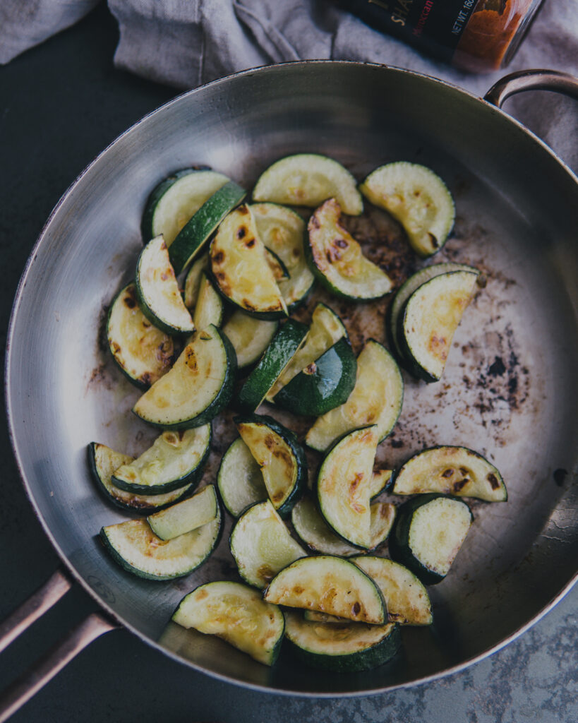 Skillet of browned zucchini.