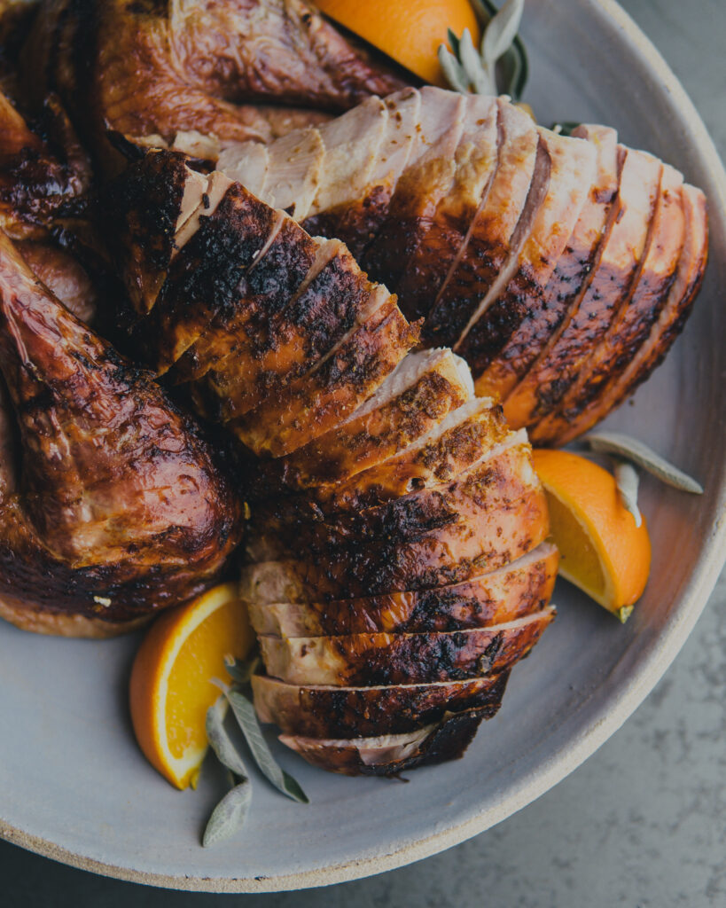 Sliced turkey breast on a serving platter.