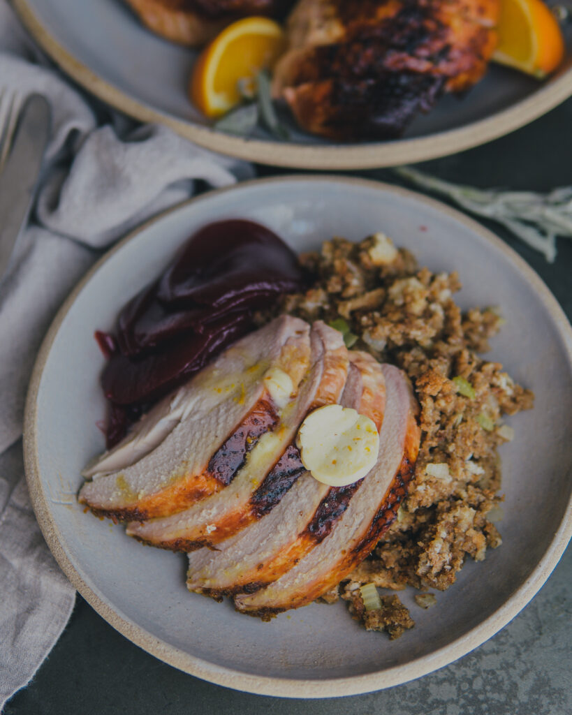 Sage & Citrus Roasted Turkey with citrus butter, stuffing and cranberry sauce. 
