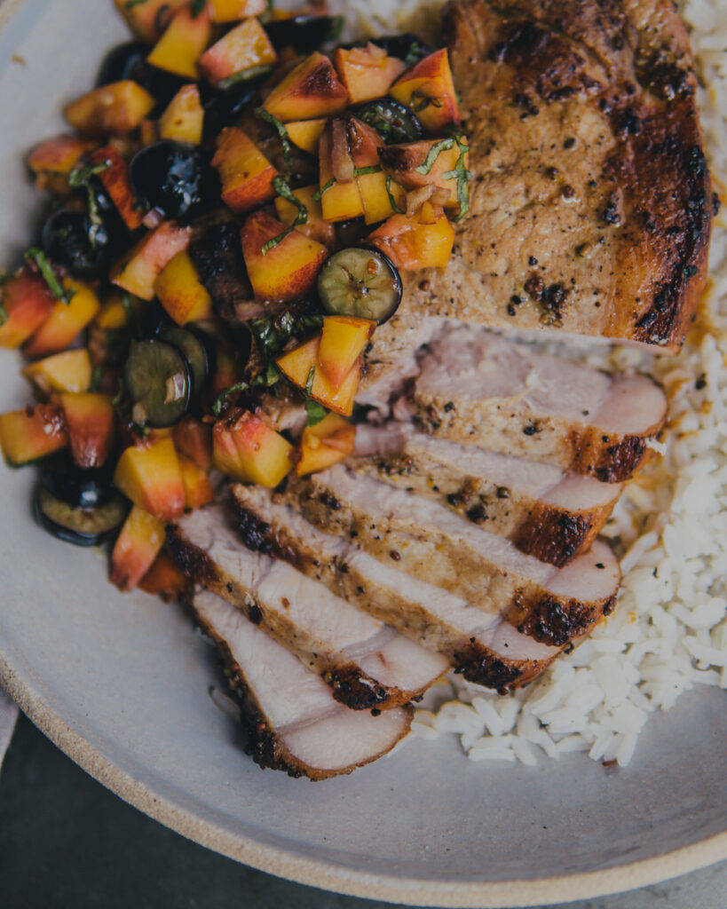Finished plate of Belcampo Pork Chops & Summer Fruit Salsa with white rice.