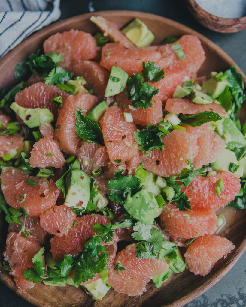 Grapefruit and avocado salad in a serving bowl. 