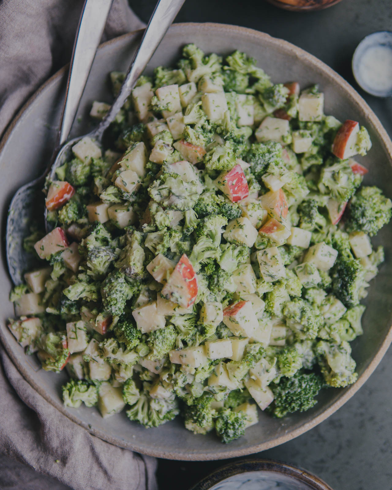 Broccoli, Apple and Cheddar Salad with Dill Ranch Dressing in a serving bowl. 