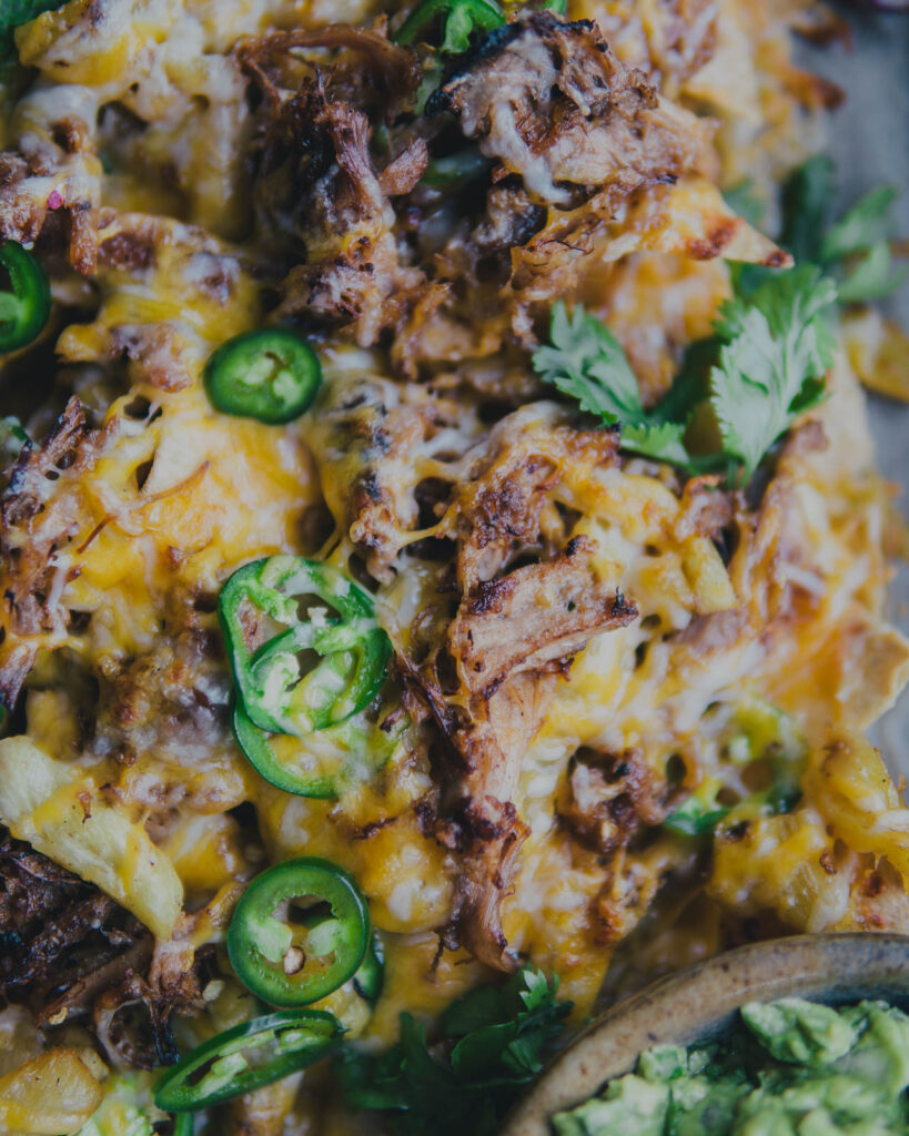 Cheesy bits of carnitas and roasted pineapple with jalapeño slices. 