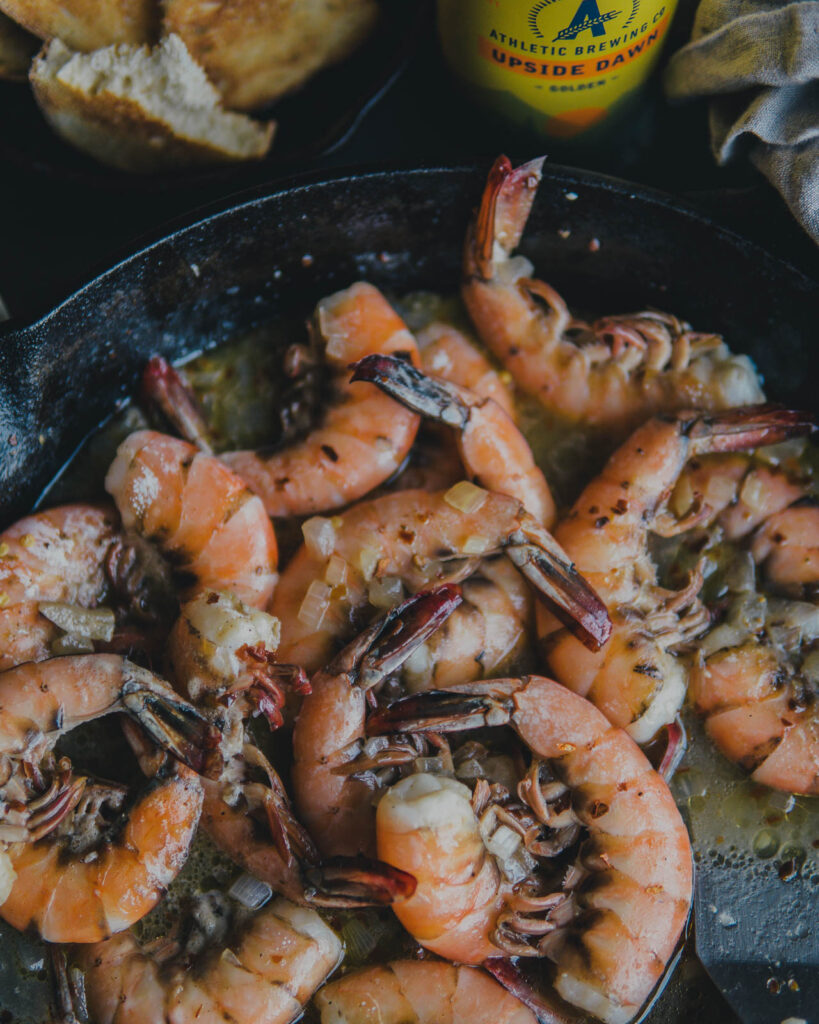 Cooked Athletic Brew Beer Shrimp in a cast iron pan.