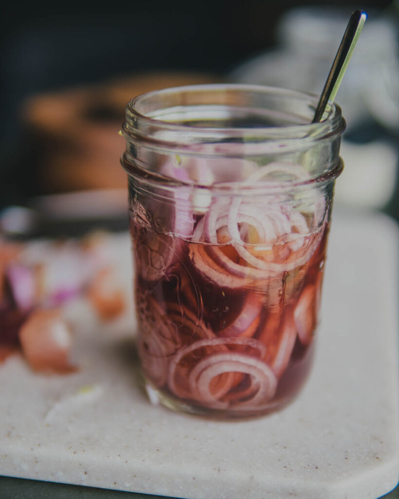 Quick Pickled Shallots in a mason jar. 