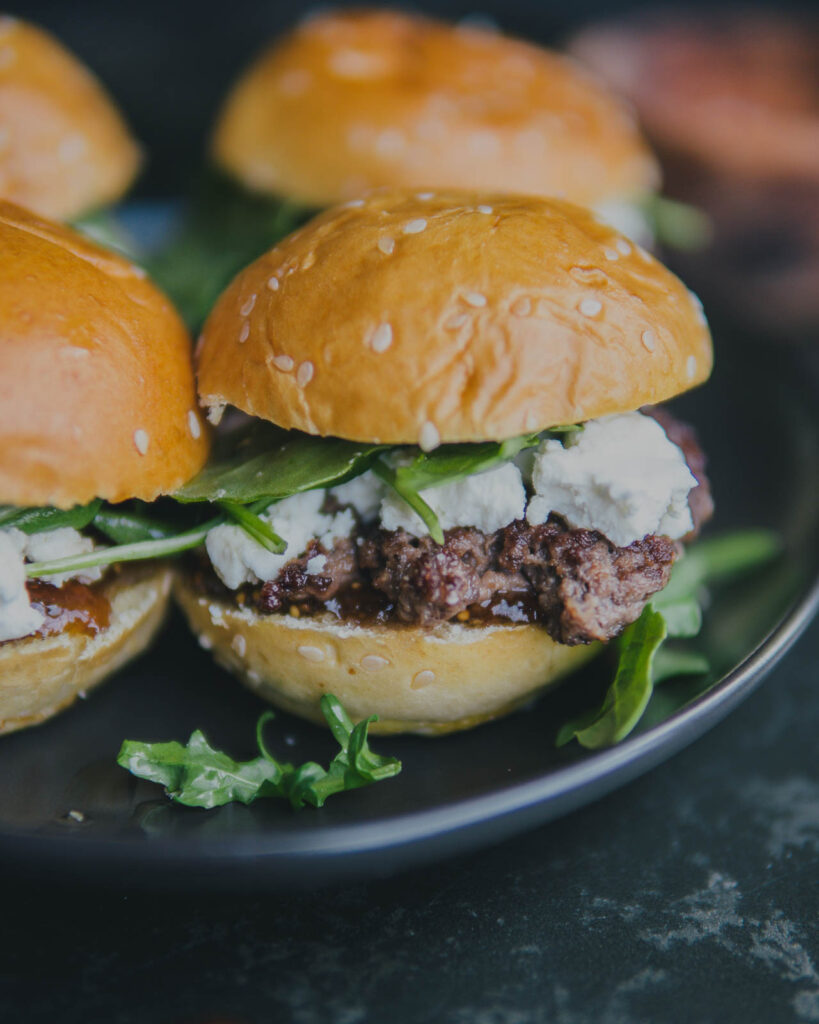 Labor Day Weekend Menu Fig and goat cheese sliders on a plate. 