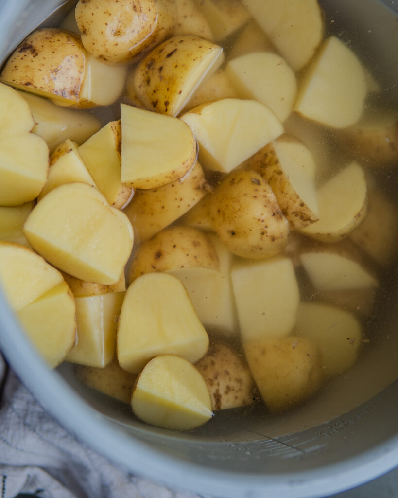 Cut up Yukon gold potatoes. 