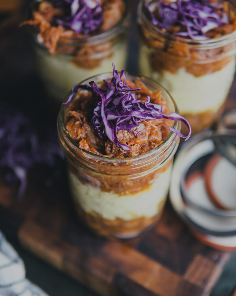 BBQ Meal Prep Mason Jars topped with shredded purple cabbage.