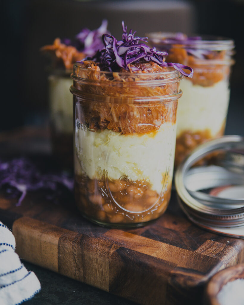 BBQ Meal Prep Mason Jar with shredded purple cabbage on top. 