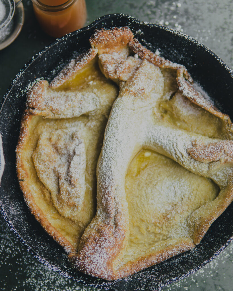 Dutch Baby topped with powdered sugar. 