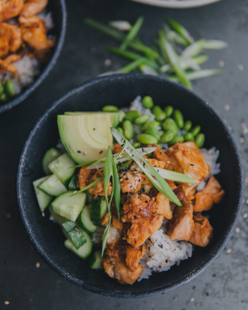 Teriyaki Salmon Bowl in a bowl topped with green onions. 